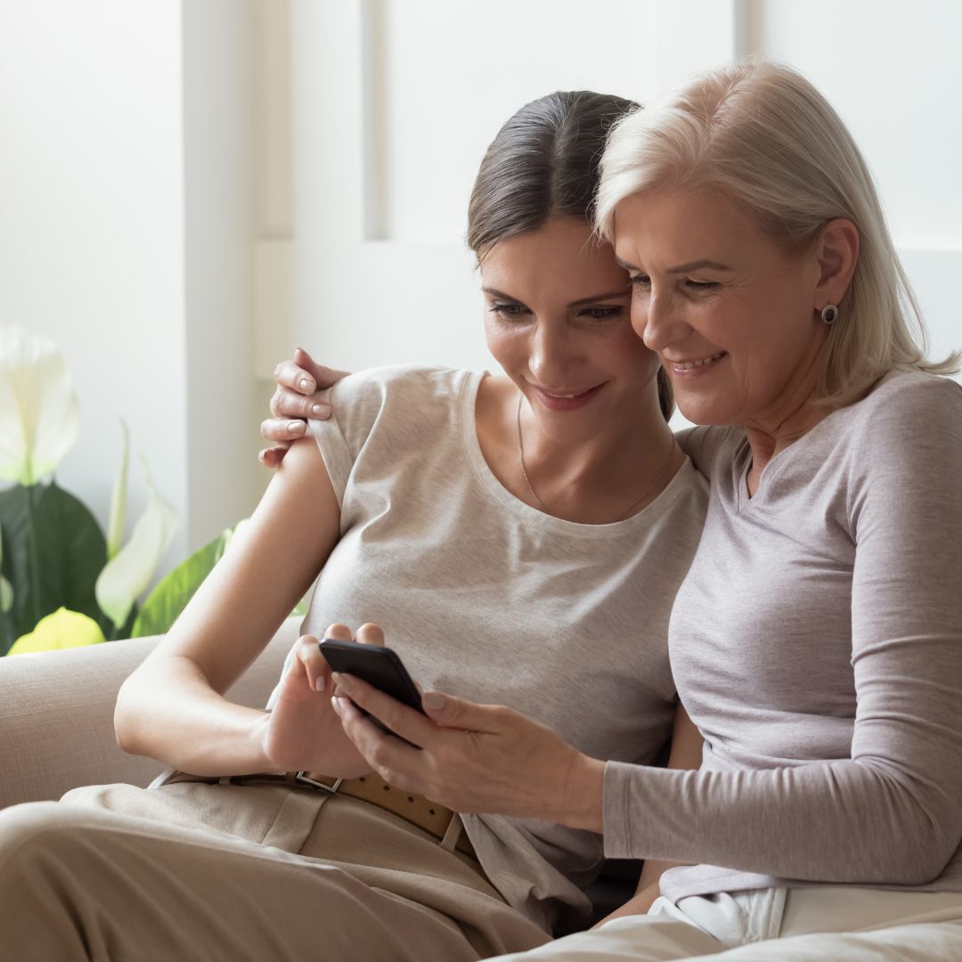 A family member engaging in a ReLiveable Interactive Reconnection, finding comfort in their loved one’s voice during hospice care.