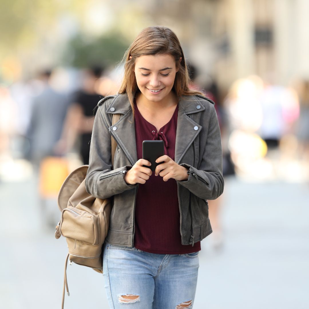 A woman speaks to a ReLiveable Interactive Voice Memorial, hearing her loved one’s voice through AI Memorial Services.