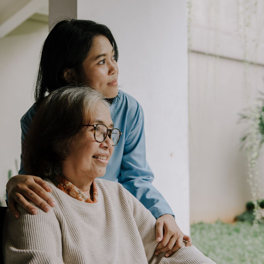 Hospice staff and family using ReLiveable’s AI tools for bereavement support in a caring setting.