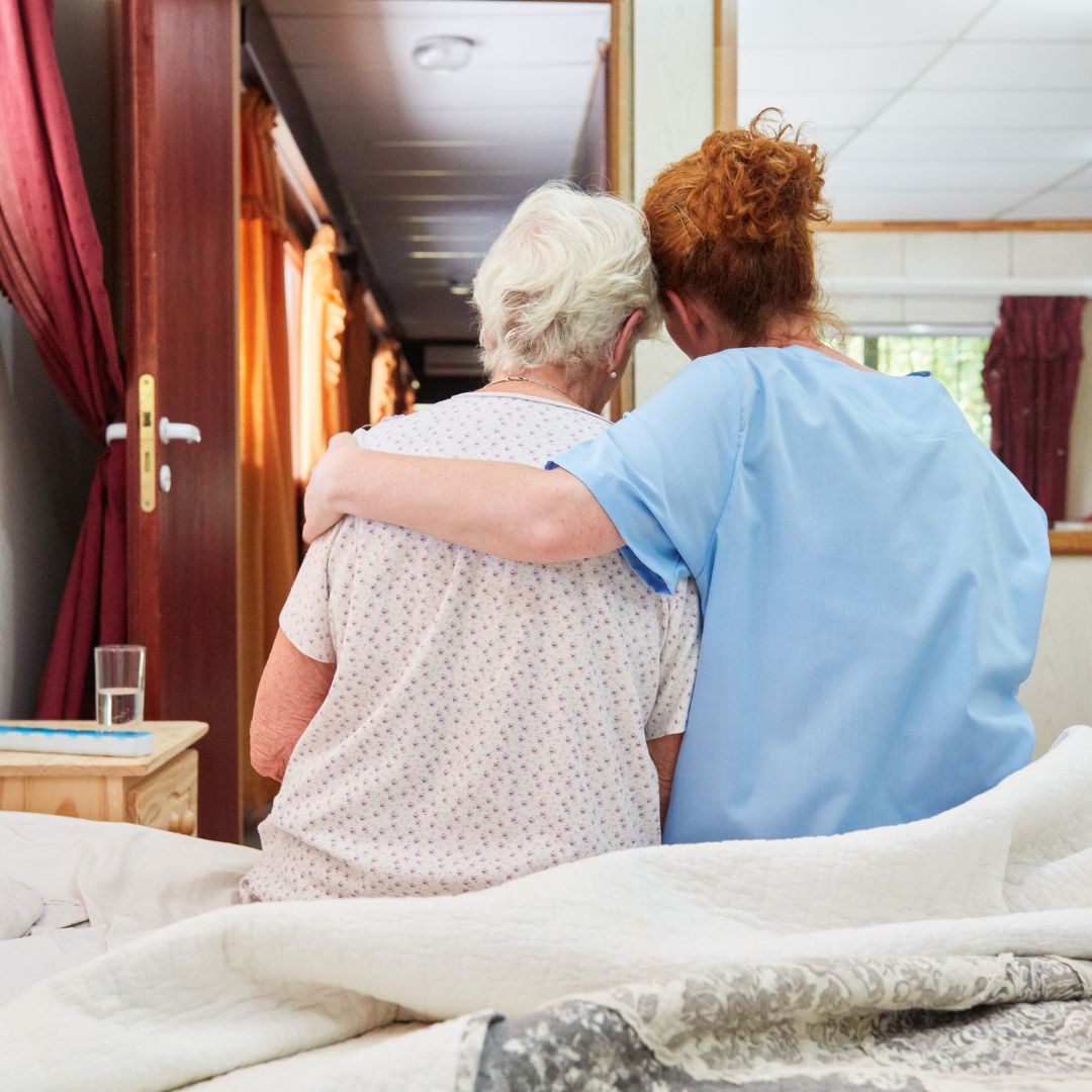 A hospice caregiver uses ReLiveable’s AI memorials for hospice care to support a family with predictive grief tools.