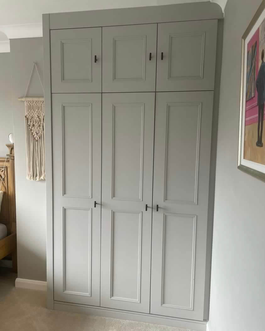 Classic bespoke fitted wardrobe in a soft grey finish with panelled doors and black handles, seamlessly built into a Yorkshire bedroom alcove. Designed, made, and installed by JAX Bespoke with 0% finance options available. Classic bespoke fitted wardrobe in a soft grey finish with panelled doors and black handles, seamlessly built into a Yorkshire bedroom alcove. Designed, made, and installed by JAX Bespoke with 0% finance options available.