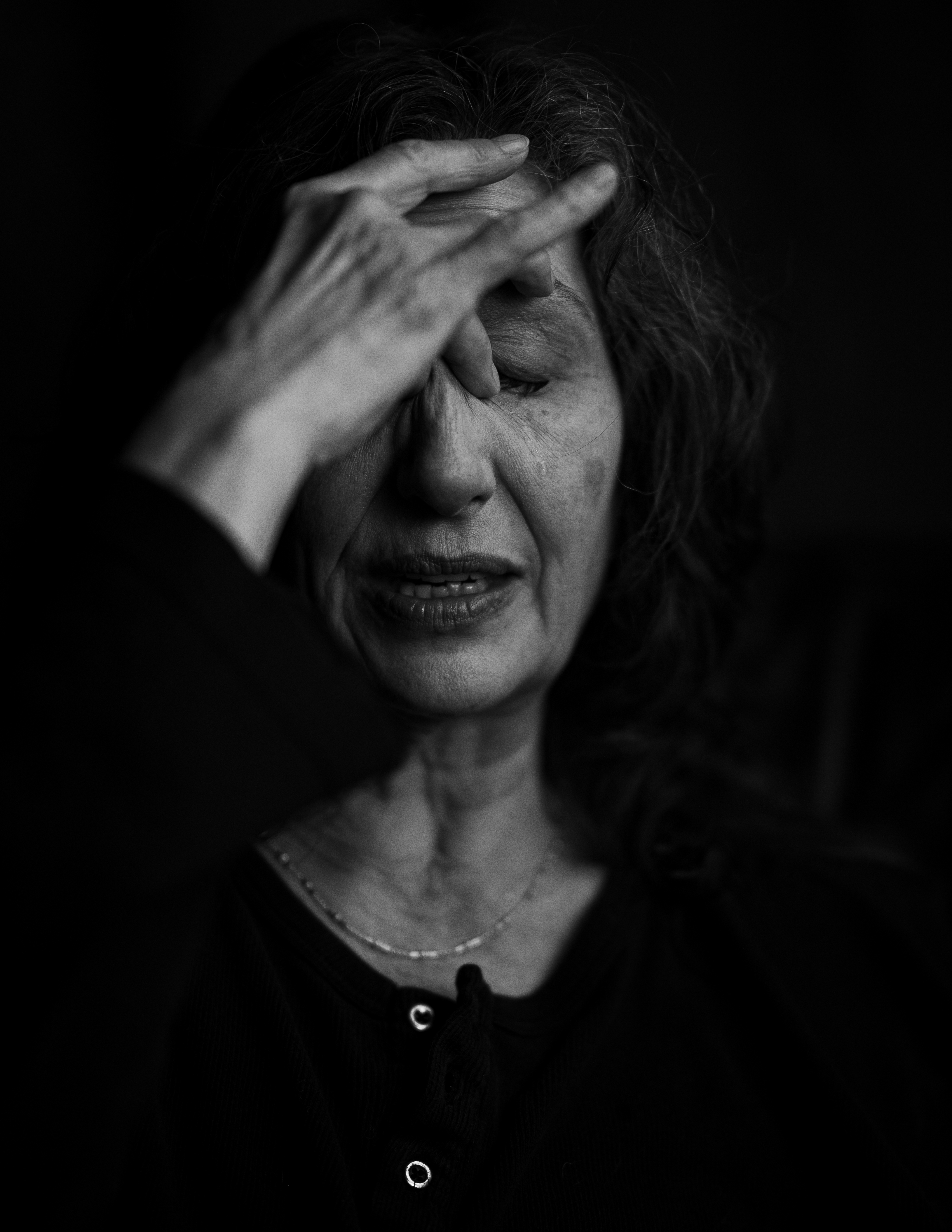 Emotional headshot of a beautiful woman in Black & White