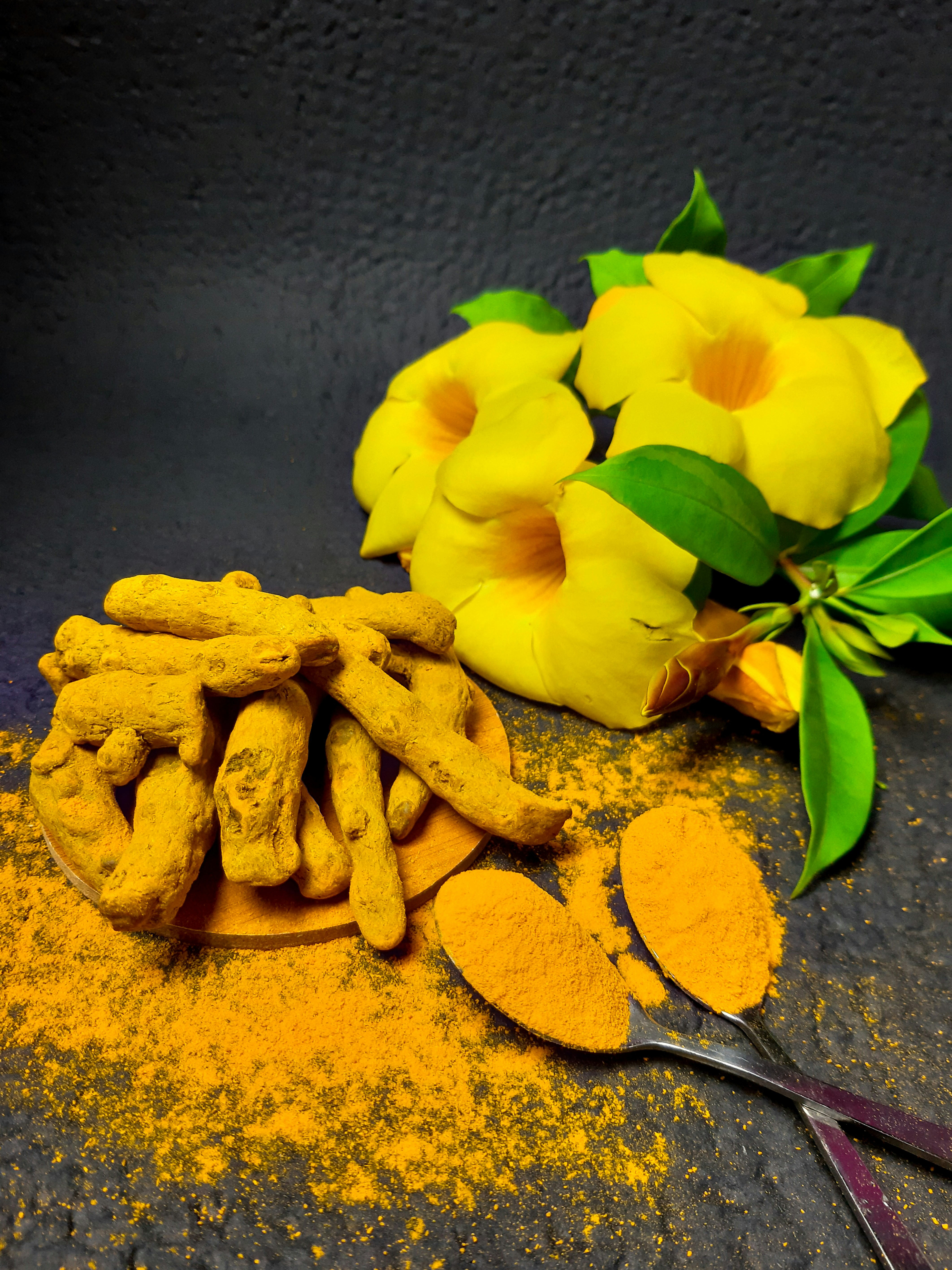 closeup of turmeric root and powder