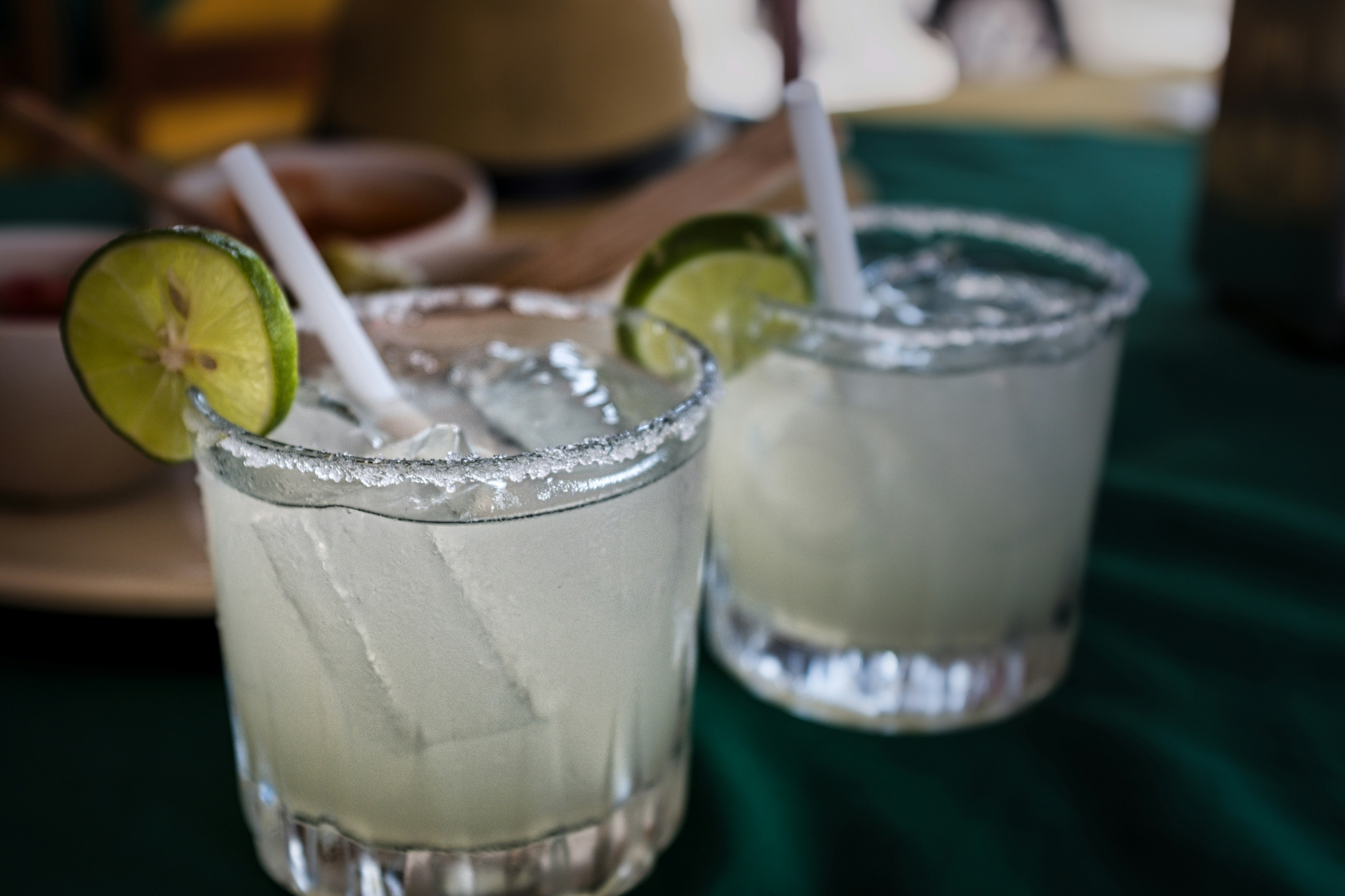 Iced margaritas are sitting on a table