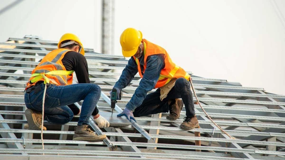 an expert roofer on commercial roofing replacement