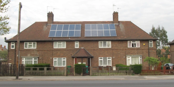 A semi-detached home with solar panels on both sides