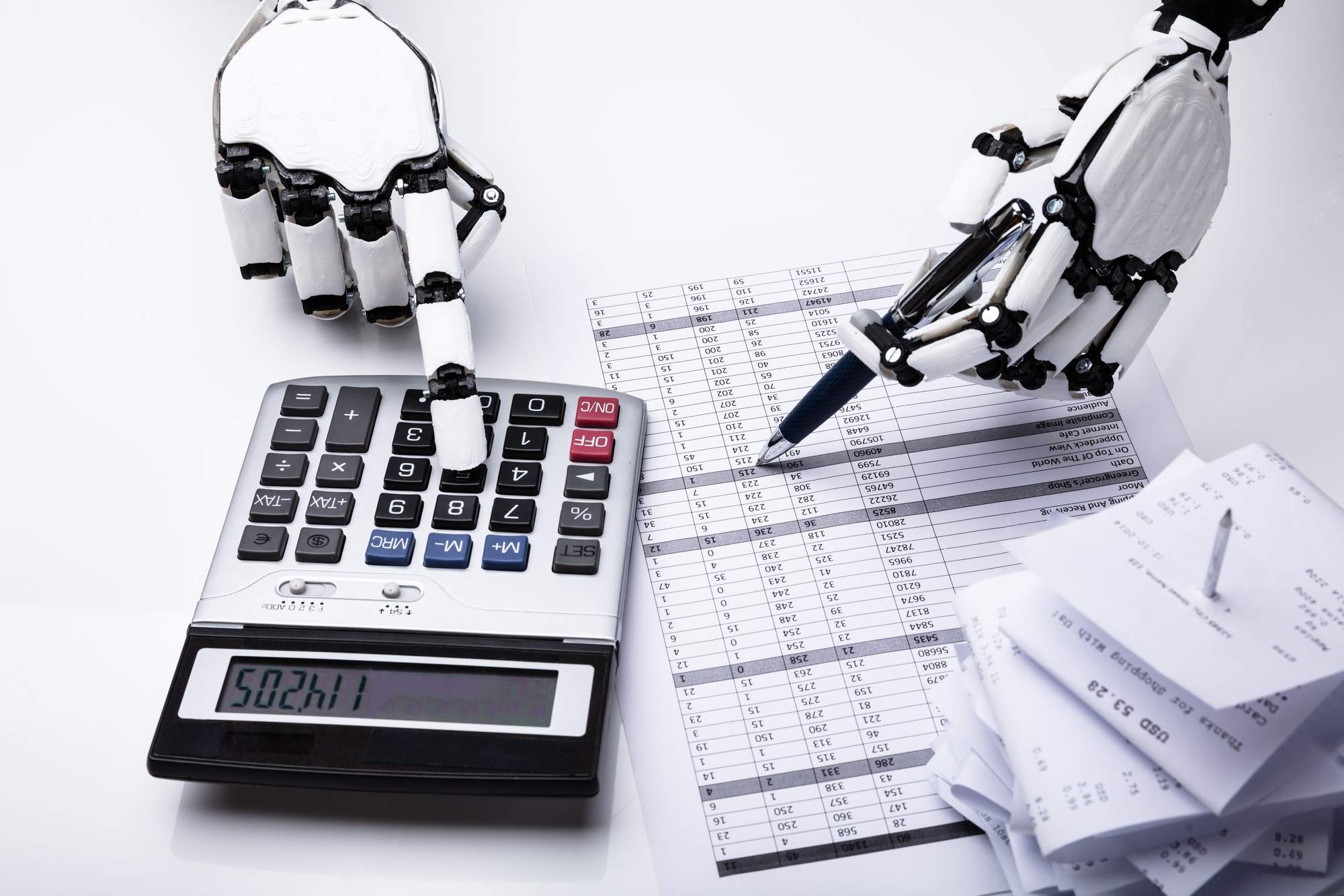 AI robot practicing bookkeeping with a calculator 