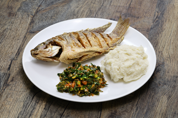 fried tilapia, ugali, sukuma wiki