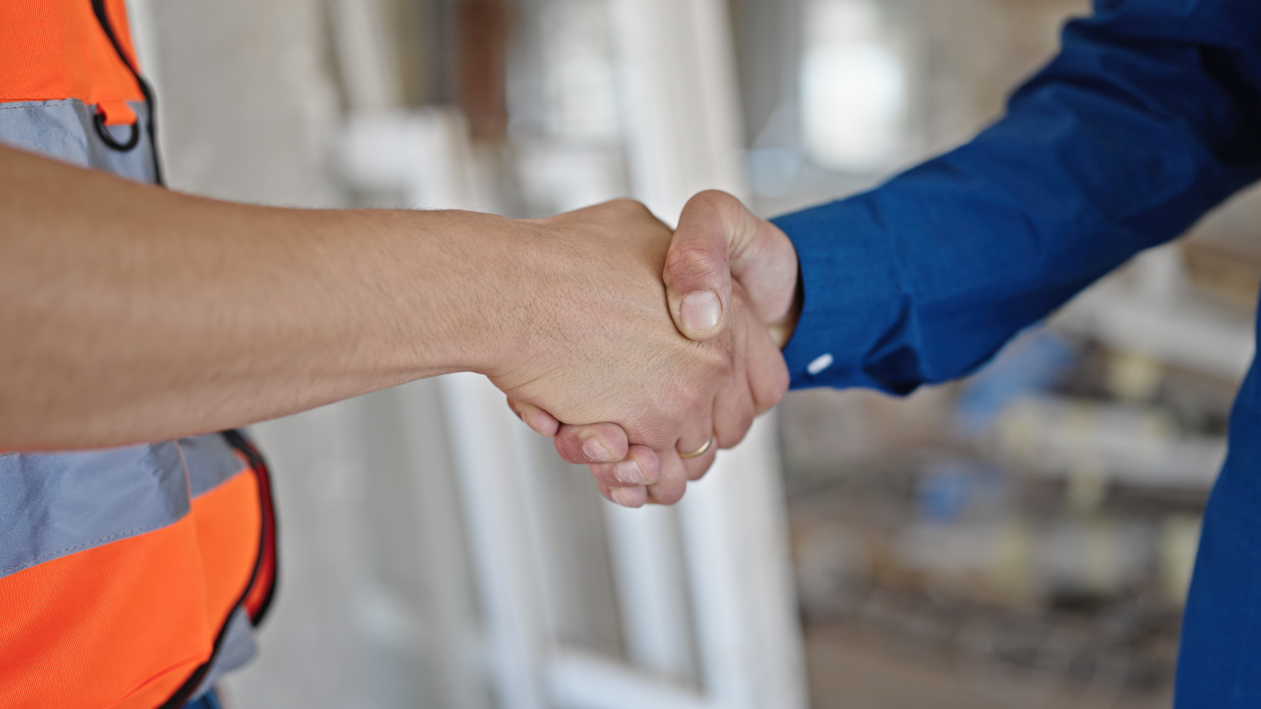 Contractor shaking hands with client - client relationships construction business Contractor shaking hands with client - client relationships construction business
