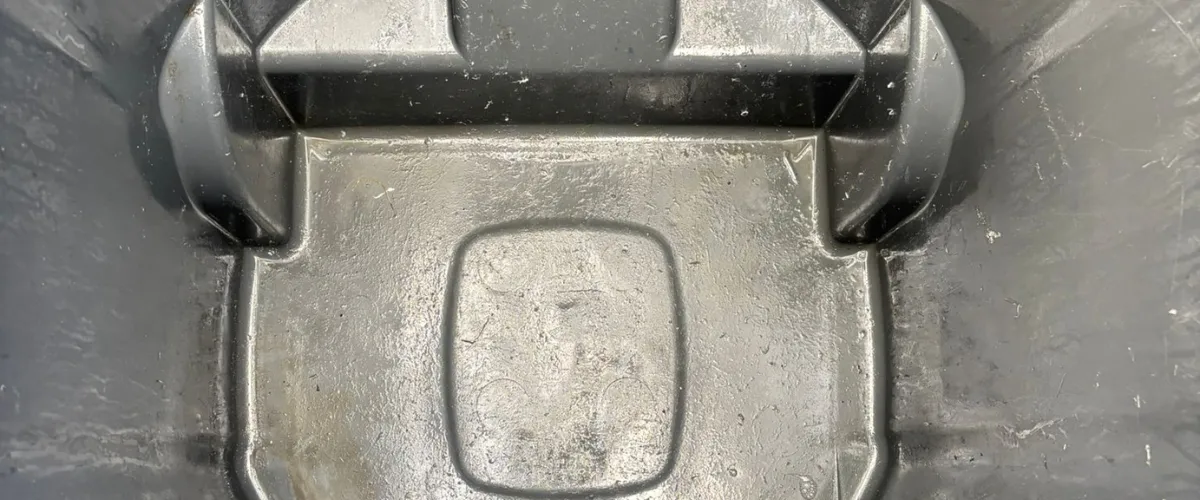 Close-up view of the inside of a dirty trash bin Close-up view of the inside of a dirty trash bin