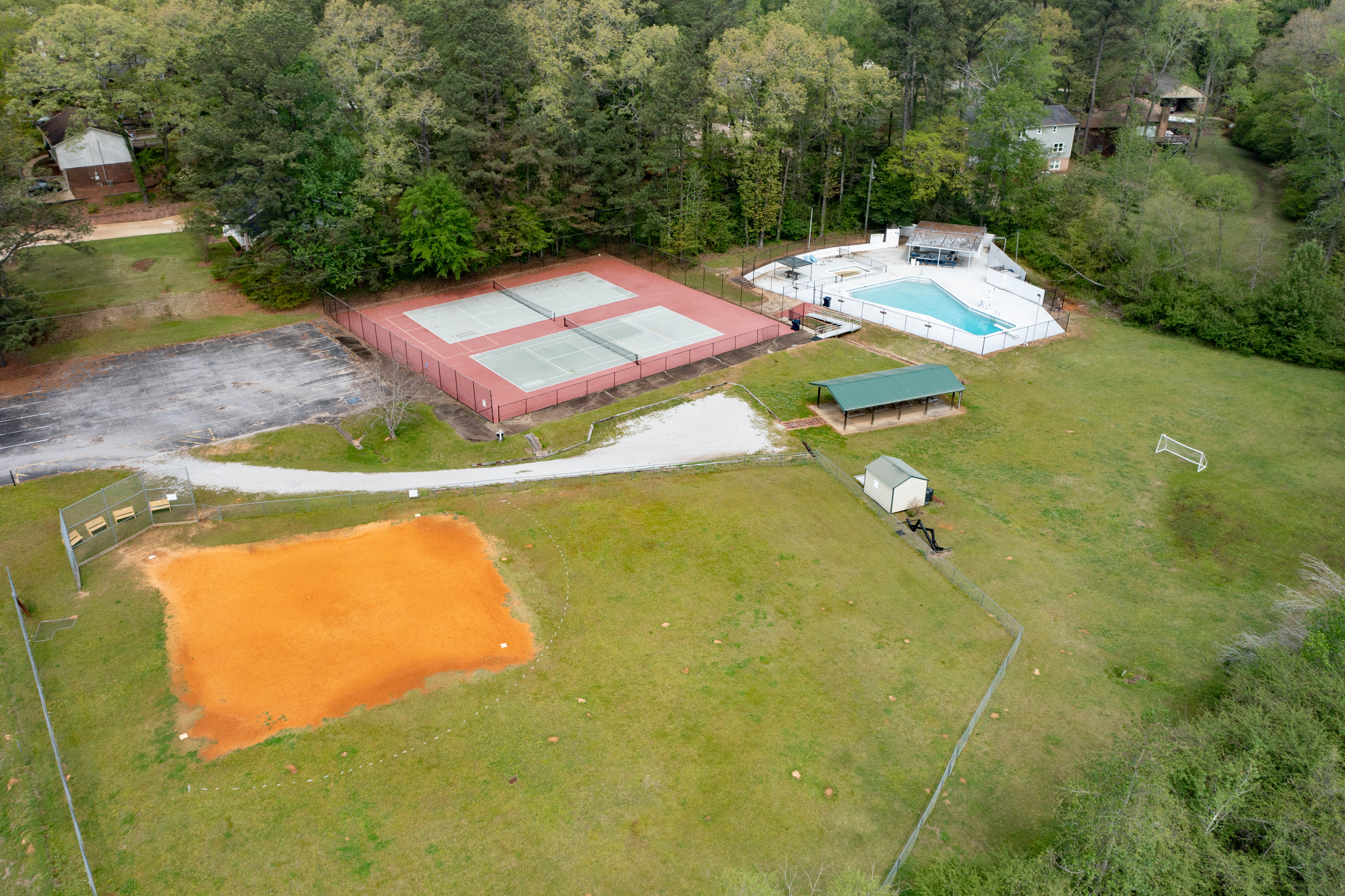 Community swimming pool, tennis courts, playground and baseball field in Northwood Lake neighborhood Northport AL