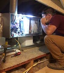 Home inspector in Tuscaloosa checking electrical system for first-time buyer.