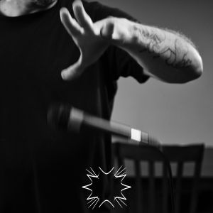 image of a hand dropping a microphone