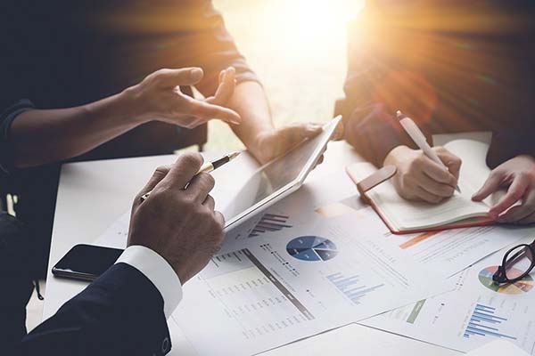 Group of business people busy discussing financial