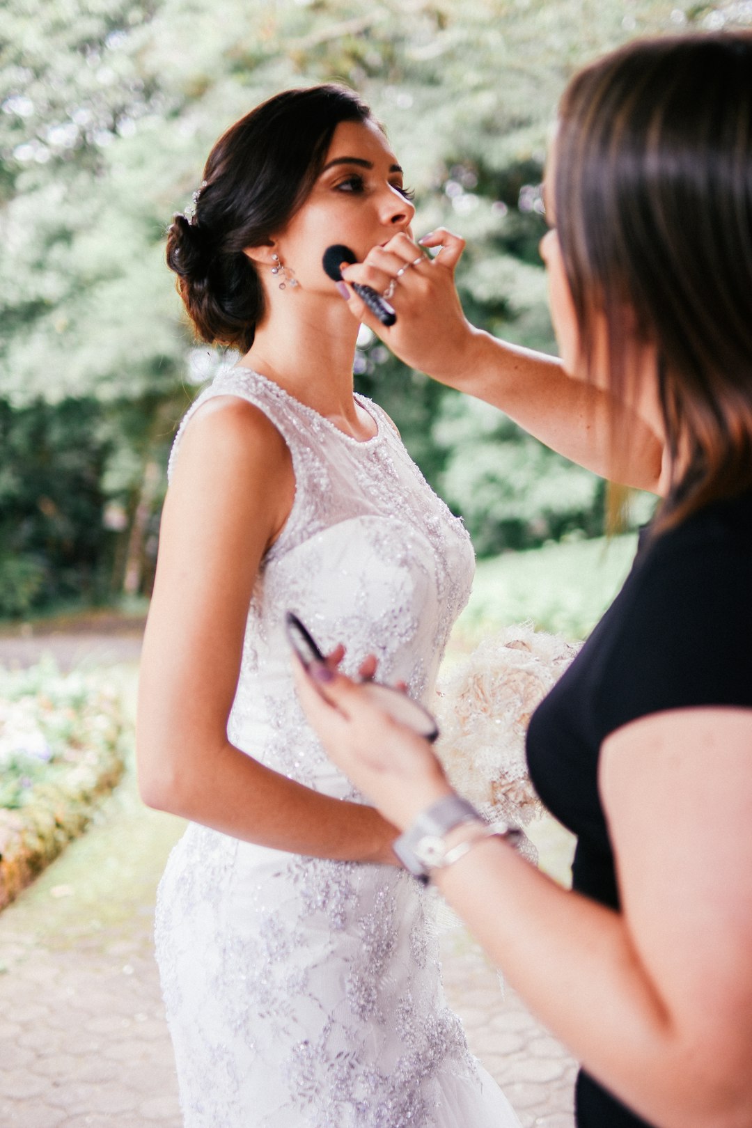 Bride having make up put on. 