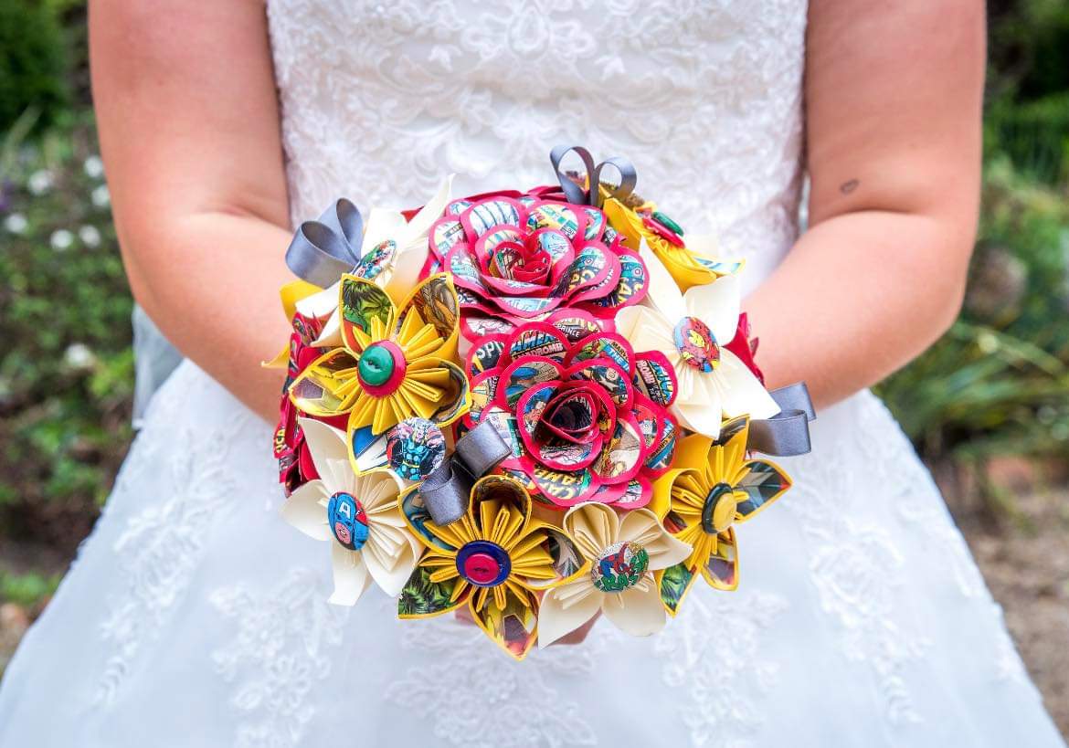 Bride holding a Marvel avengers bouquet. 