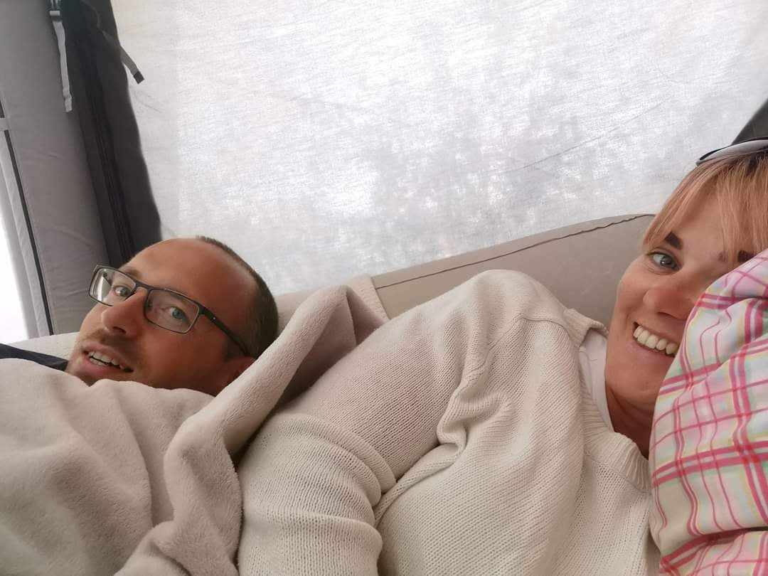 David and I hiding from the ran on our camping trip. 