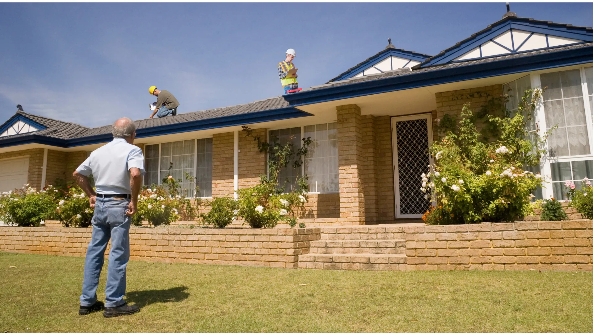 Roof inspection professional on a roof