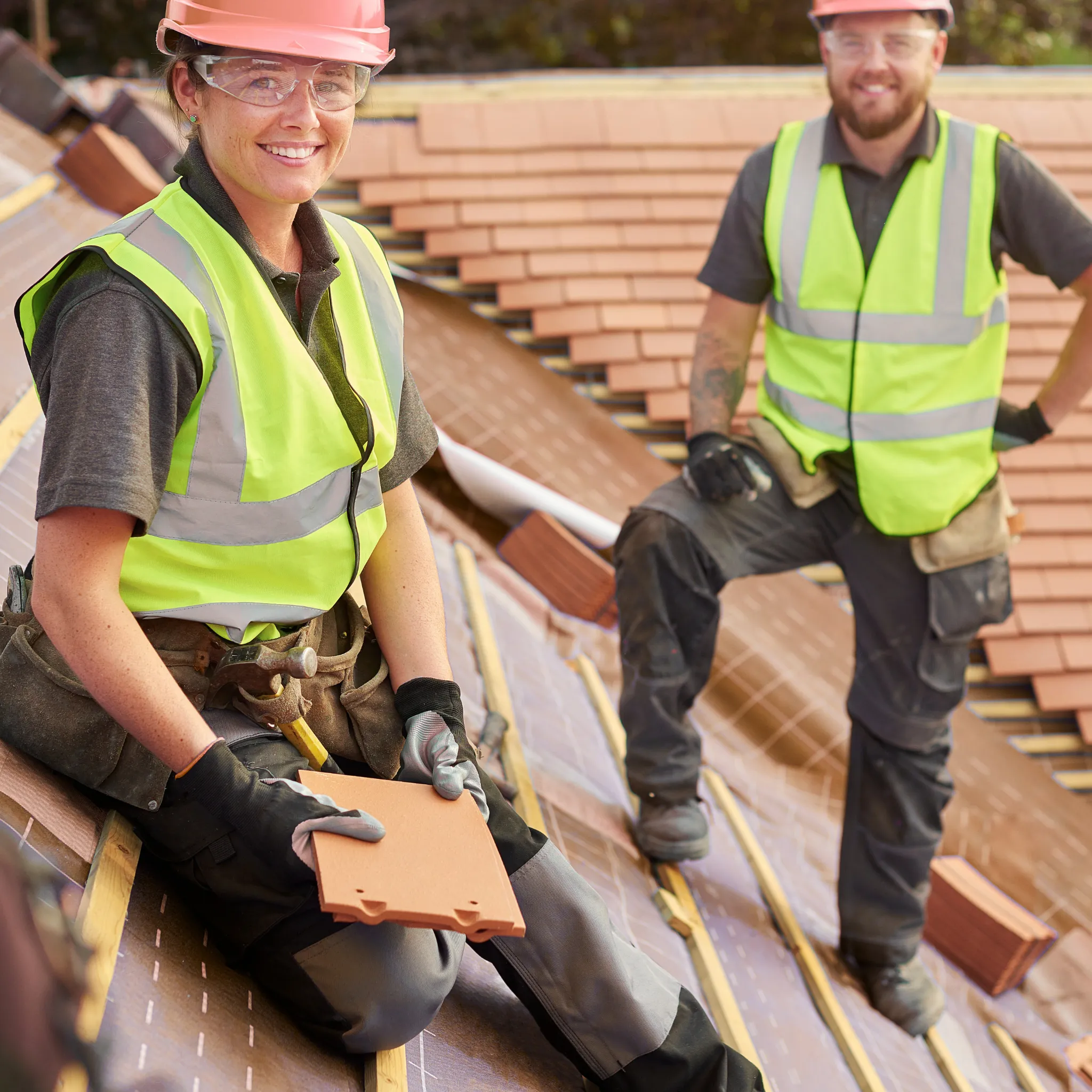 A professional inspecting a roof for storm damage.