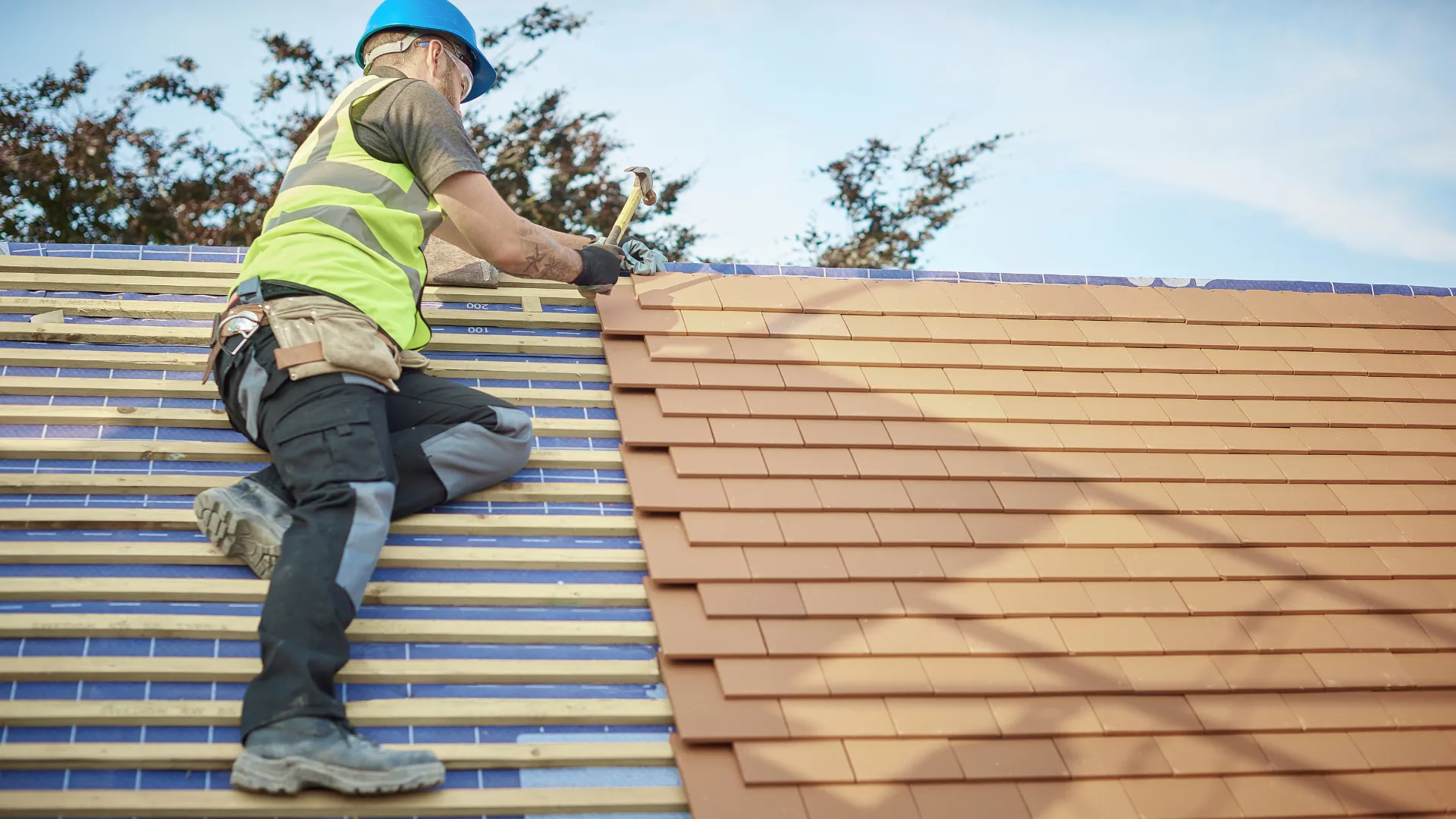 A freshly installed clay tile roof on a modern building.