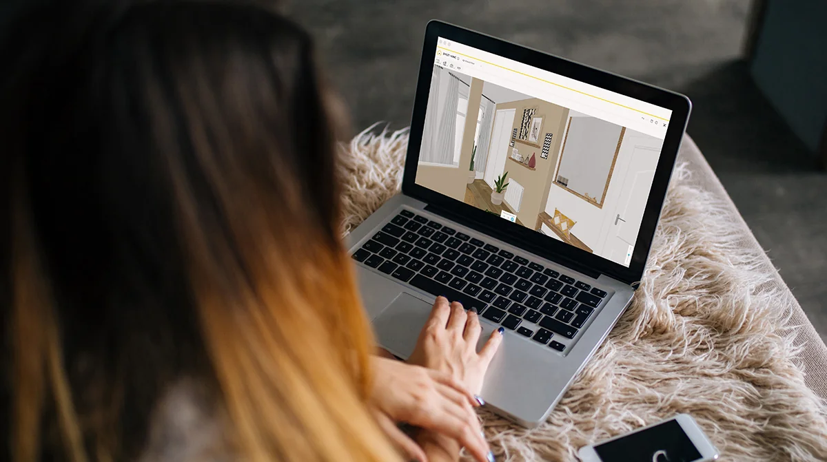 person on a laptop during a virtual apartment tour person on a laptop during a virtual apartment tour
