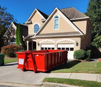 Dumpster being delivered to a home