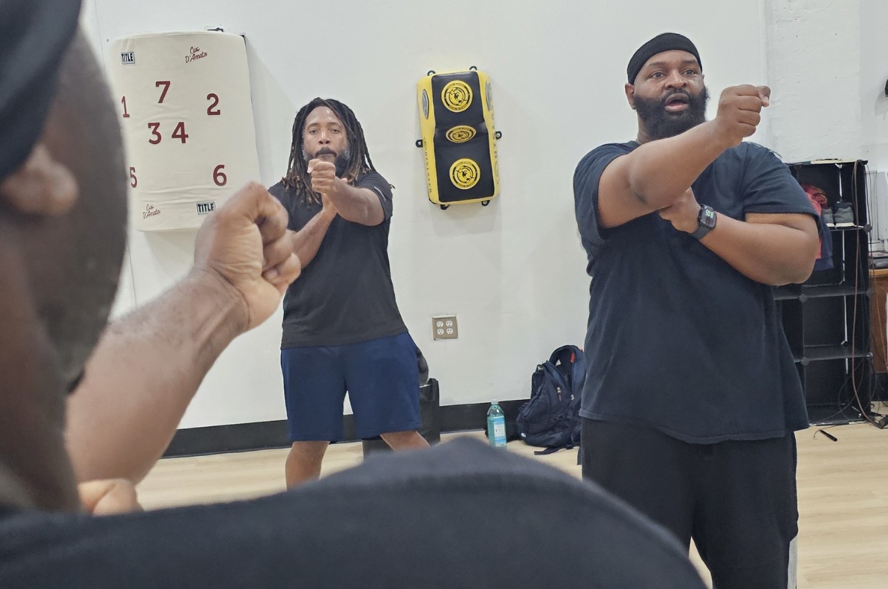 Martial arts instructor with kids