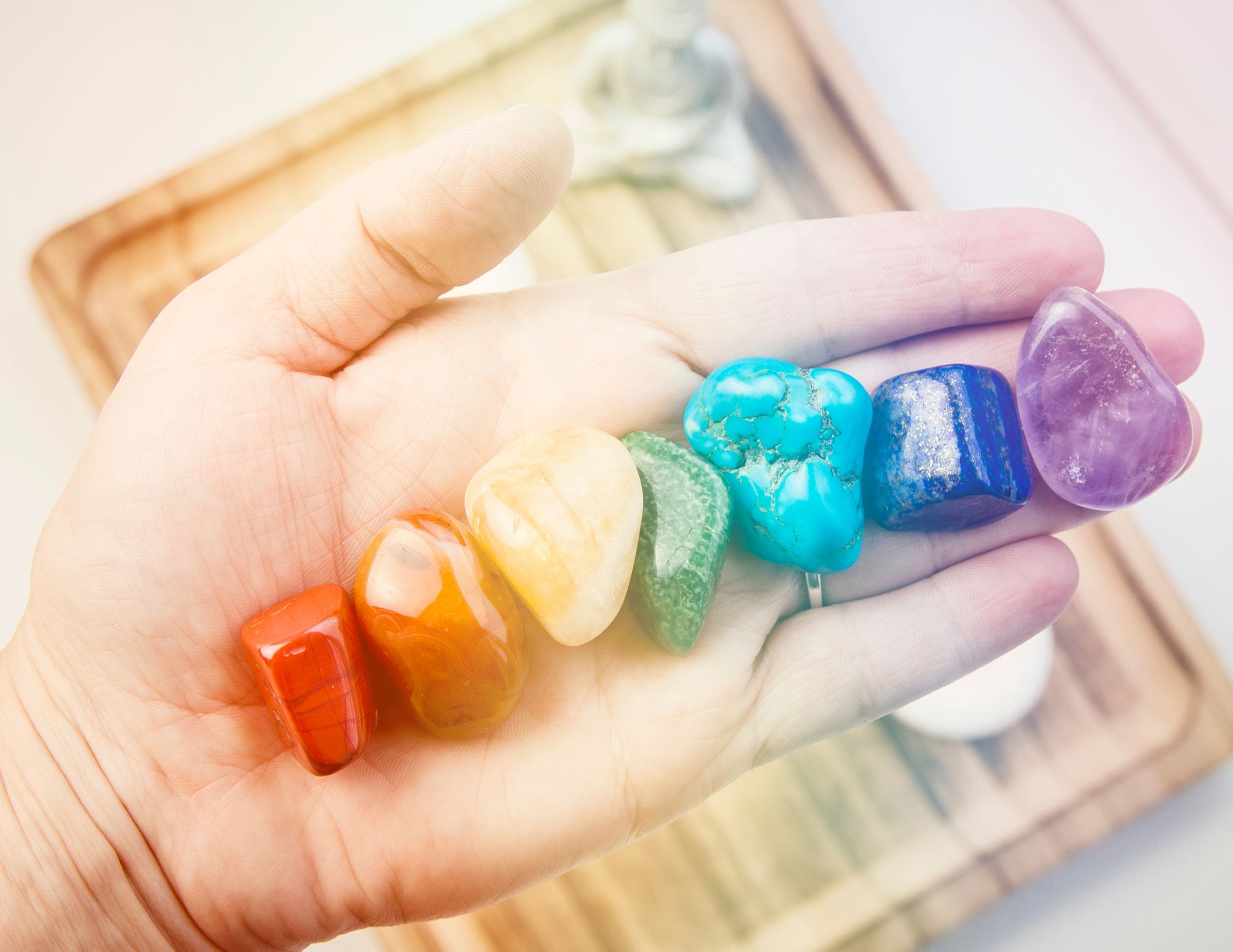 hand with chakra crystals