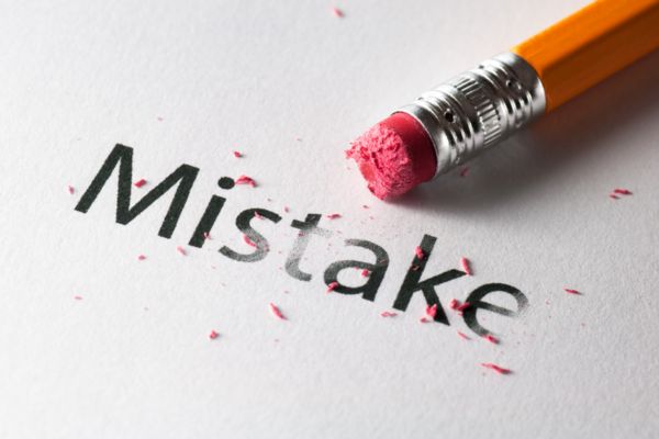 Pencil erasing the word mistake