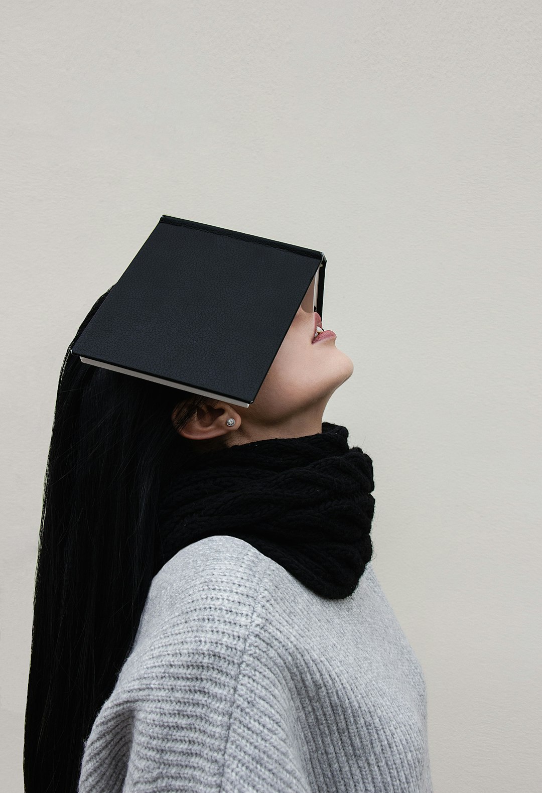Woman with a book on her head