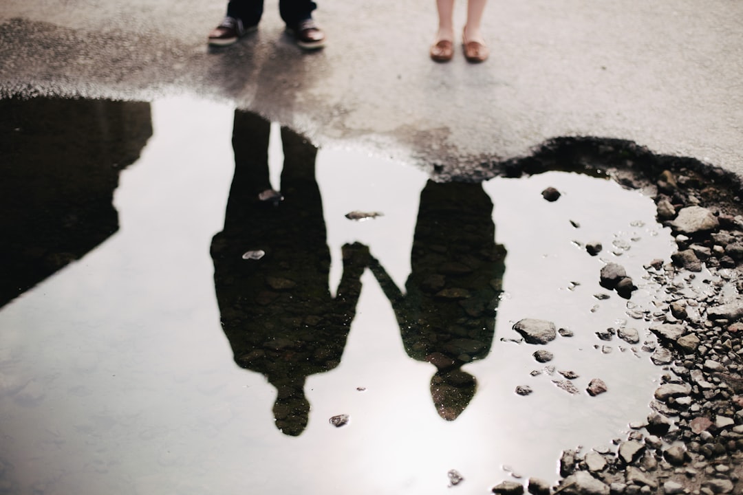 reflection of couple holding hands