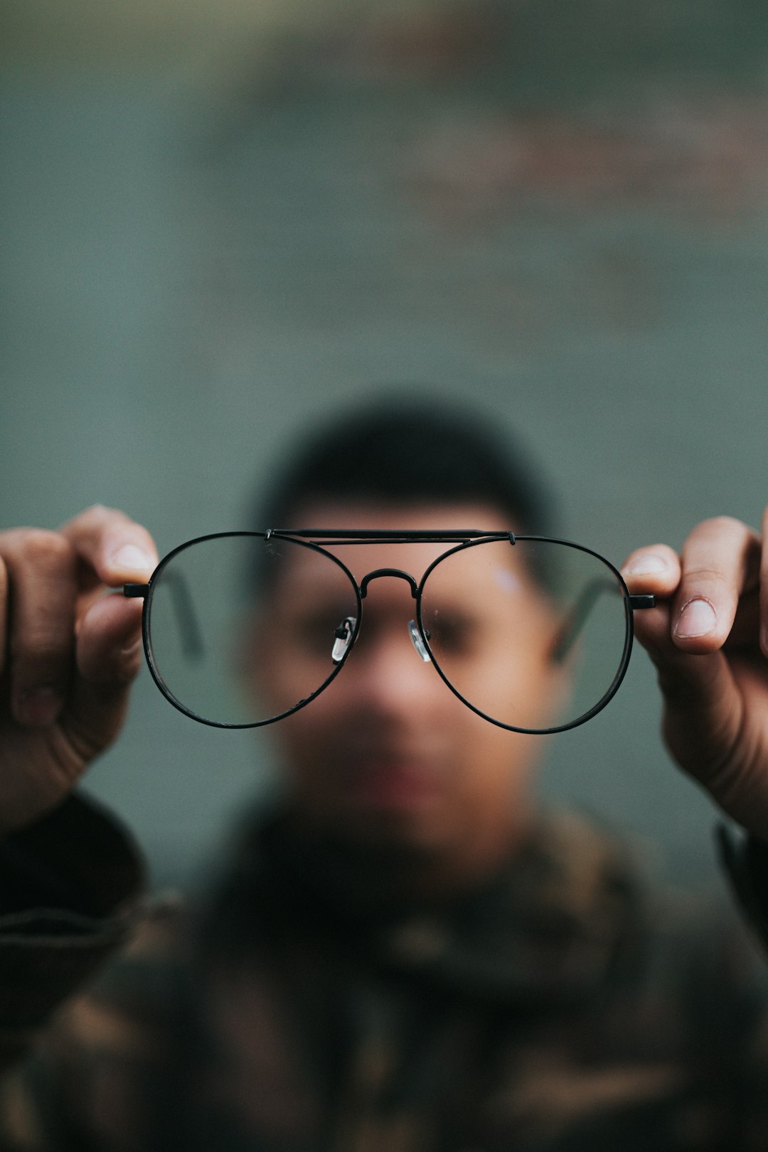 person looking through glasses person looking through glasses