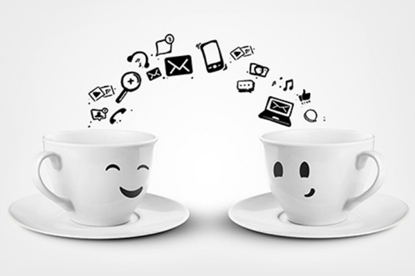 Two coffee cups with smiling faces and icons representing online presence strategies for becoming an authority in your field.