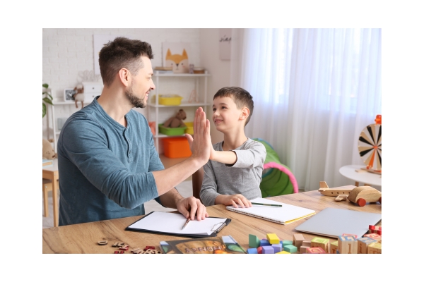 a man and a child is doing a high five a man and a child is doing a high five