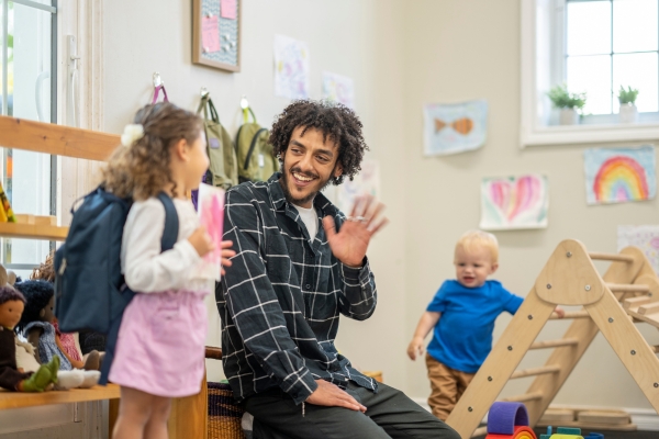 a man and a child waving goodbye