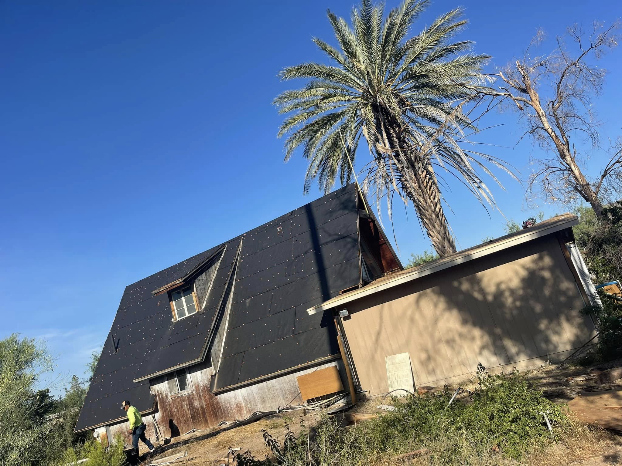 Concrete tile roof with ridge caps and flashing