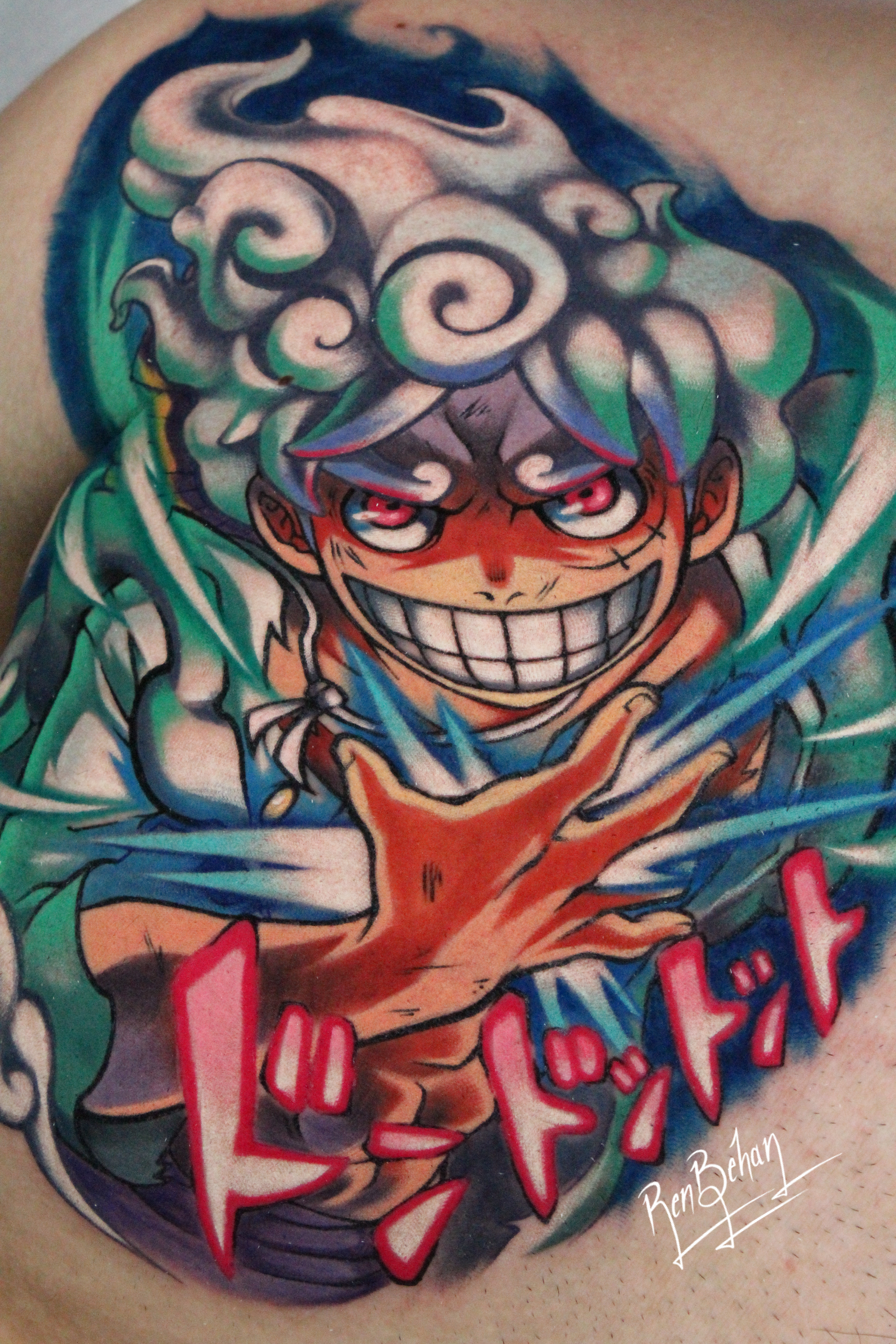 Large anime tattoo of Gear Five Monkey D. Luffy from One Piece, featuring his swirling cloud-like hair and glowing pink eyes. Large anime tattoo of Gear Five Monkey D. Luffy from One Piece, featuring his swirling cloud-like hair and glowing pink eyes.