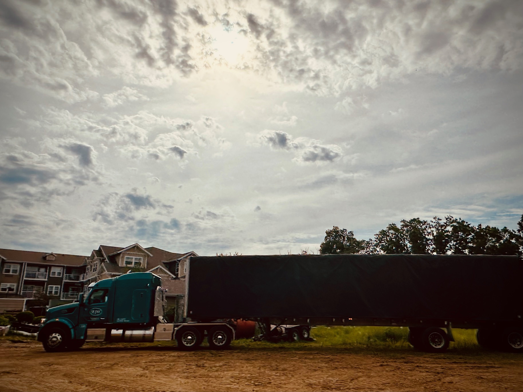 trucks with metal building are coming