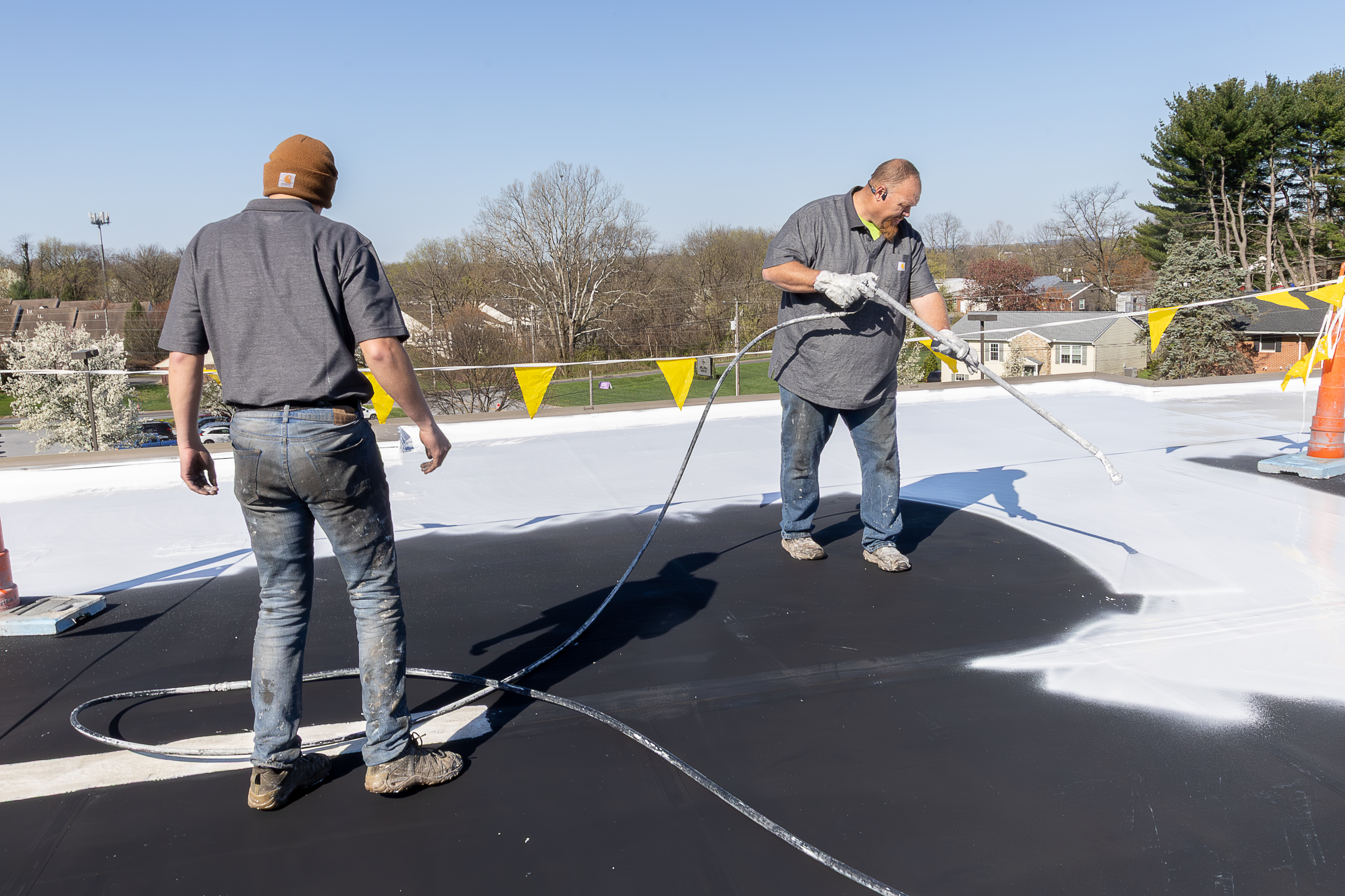 Team spraying EPDM coating