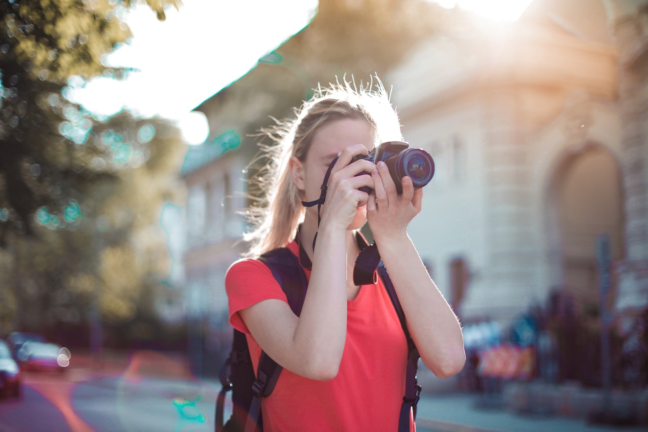 woman photographer taking photos for her google business profile