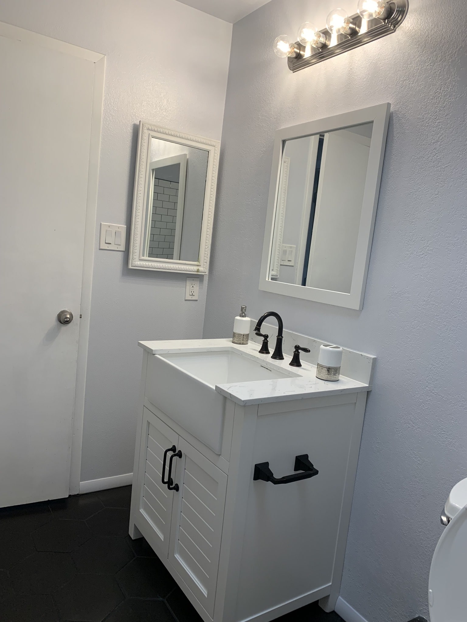 a bathroom with a sink and mirror