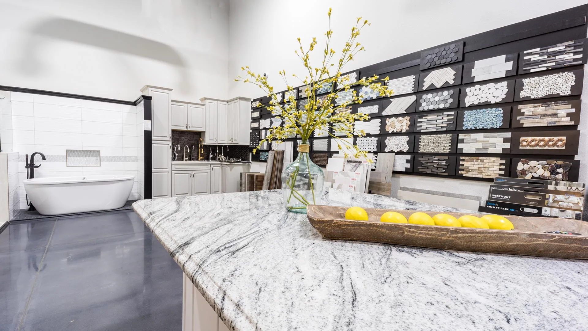 A modern kitchen with white marble countertops