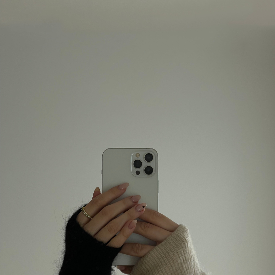 women holding an iPhone women holding an iPhone