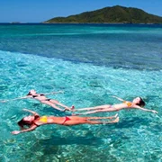 people tubing in the ocean