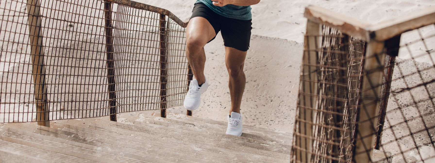 Man running up stairs for fat loss and natural testosterone boost through high-intensity exercise. Man running up stairs for fat loss and natural testosterone boost through high-intensity exercise.