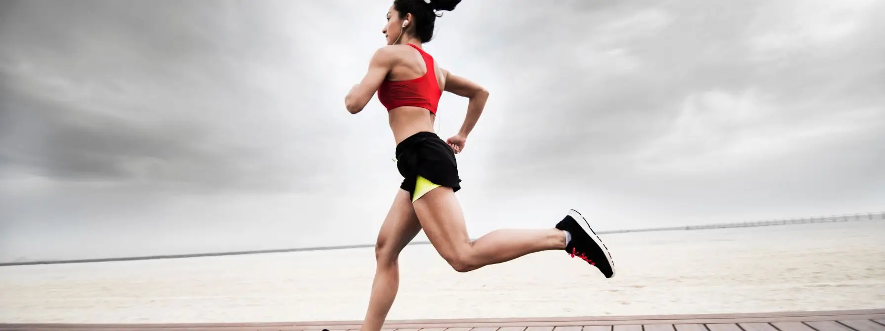 Fit woman running outdoors to reduce visceral fat and improve cardiovascular and metabolic health Fit woman running outdoors to reduce visceral fat and improve cardiovascular and metabolic health
