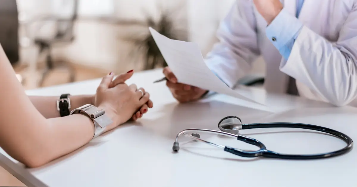 Doctor reviewing hormone therapy options with a patient during a consultation, explaining how BHRT can enhance muscle gain and support lean body mass. Doctor reviewing hormone therapy options with a patient during a consultation, explaining how BHRT can enhance muscle gain and support lean body mass.