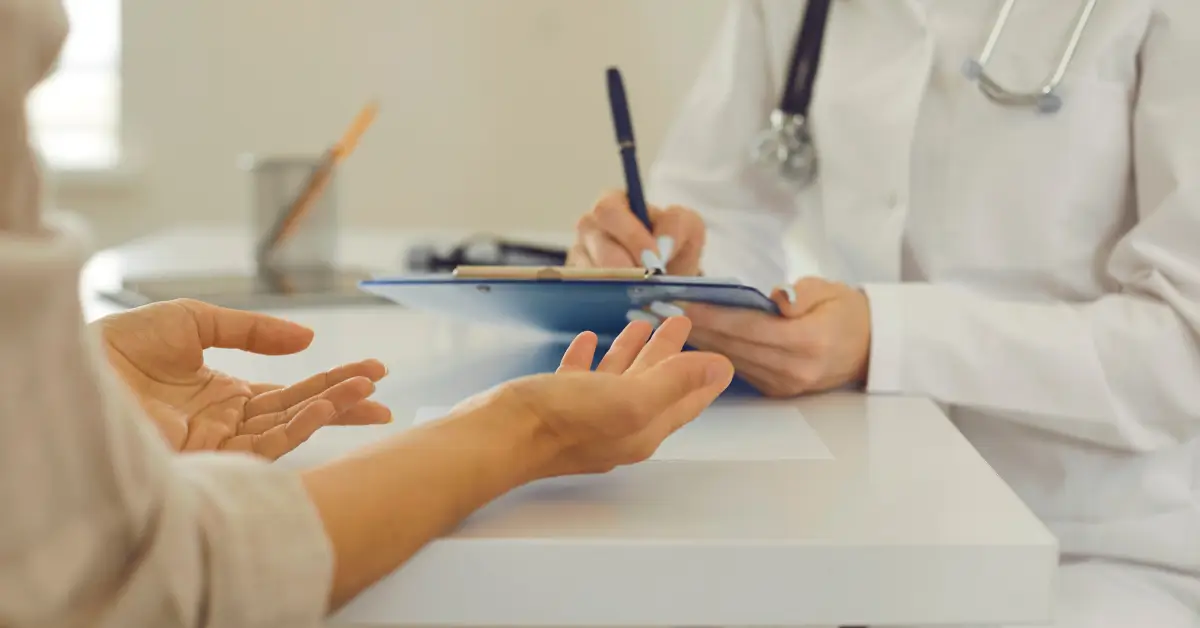 Patient discussing hormone therapy options with a healthcare provider, addressing questions about bioidentical testosterone safety and uses.