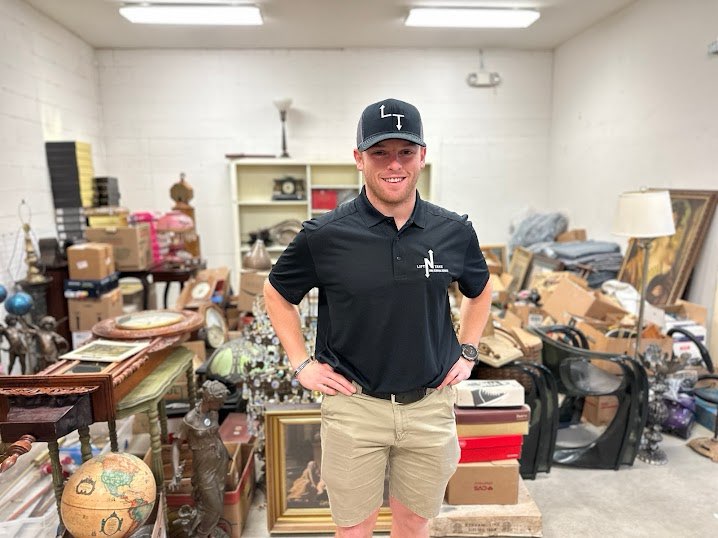 Lift N Take team members unloading debris at the yard