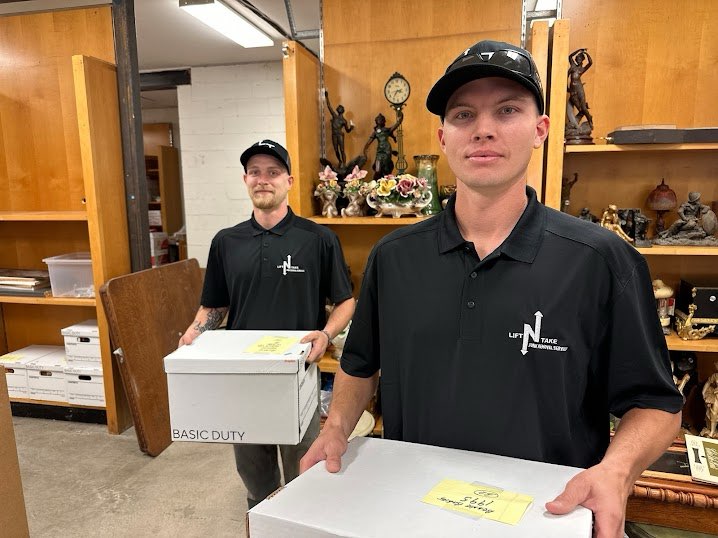 Lift N Take crew loading furniture onto a trailer